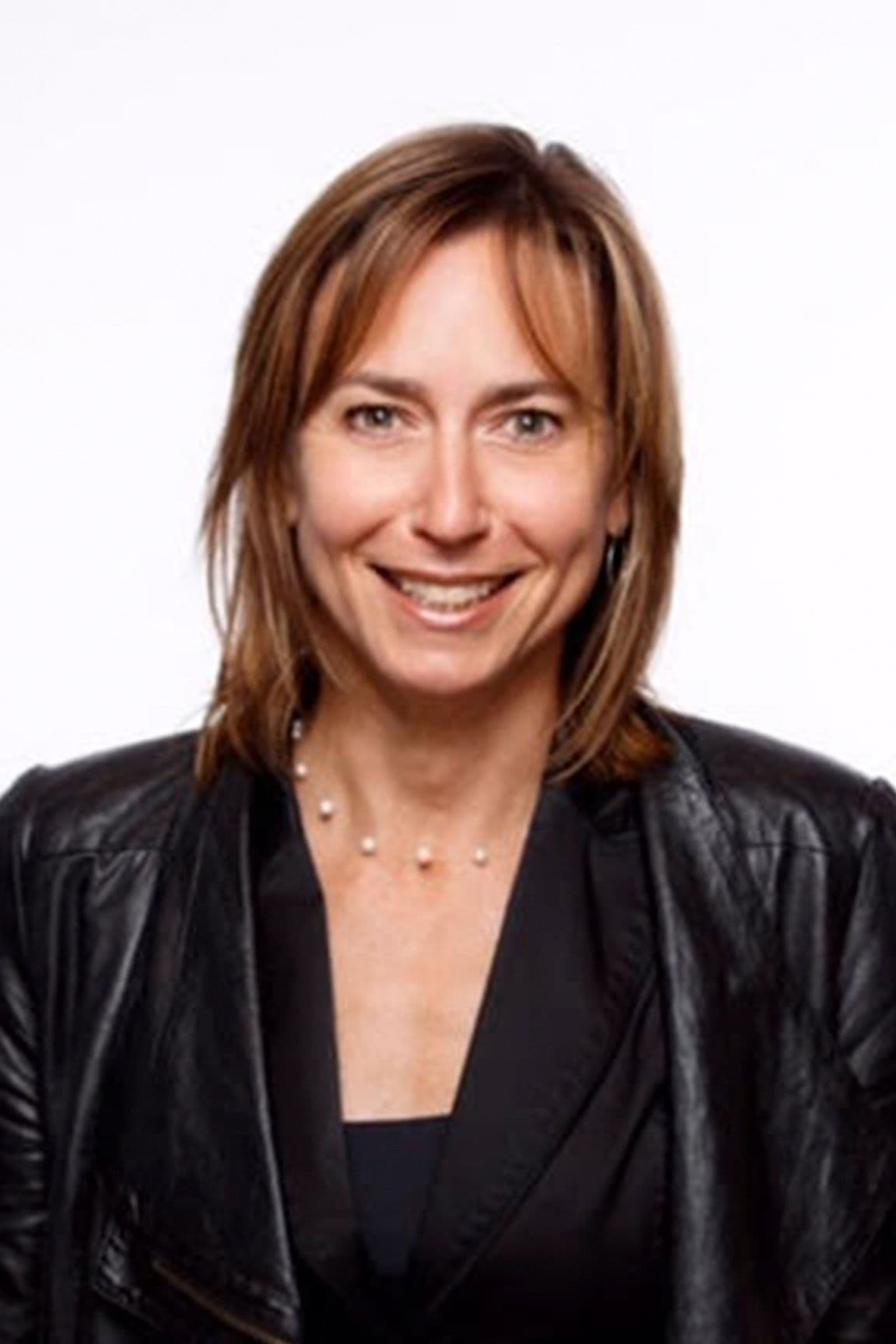 Headshot of Andrea Sullivan against a white backdrop.
